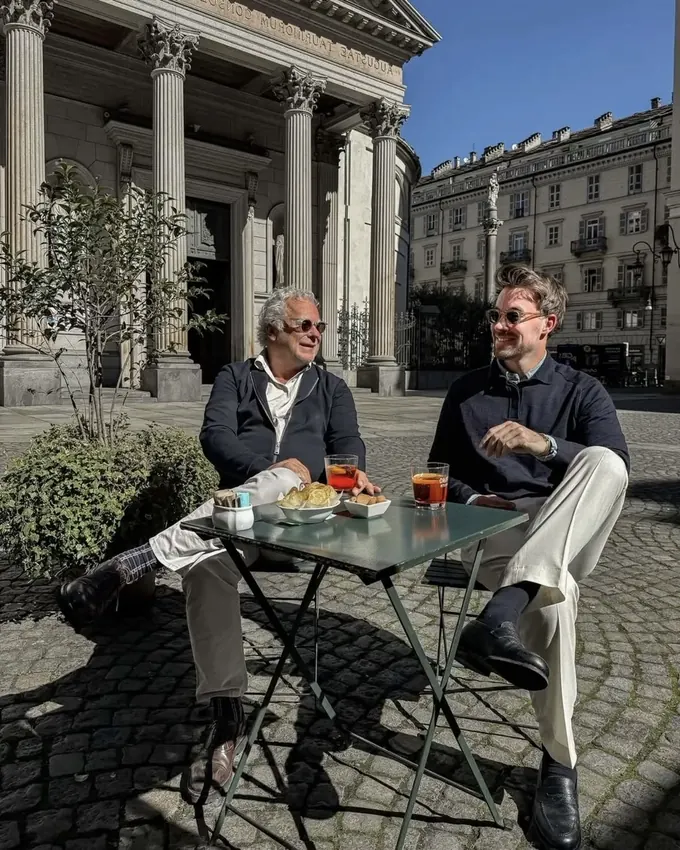 Two men having coffee outdoors