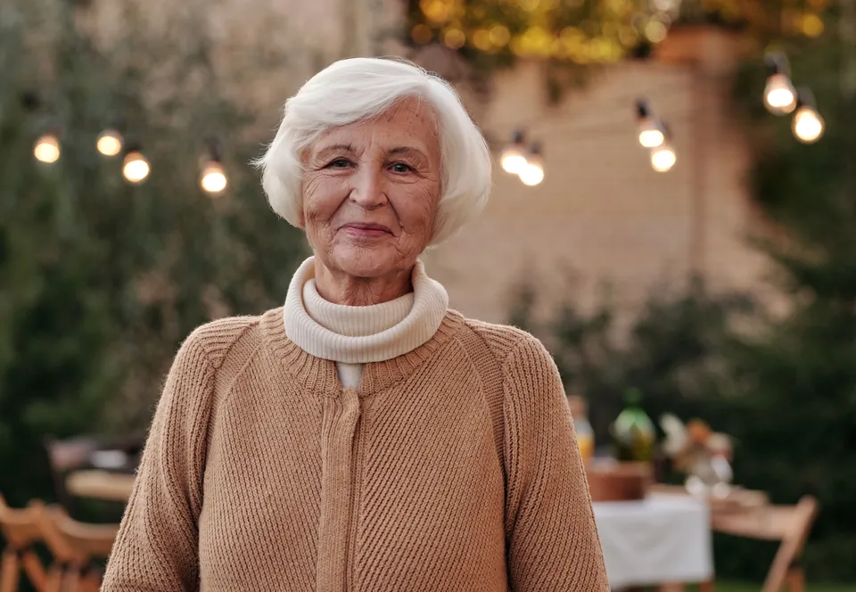 Marianne smiling in a garden